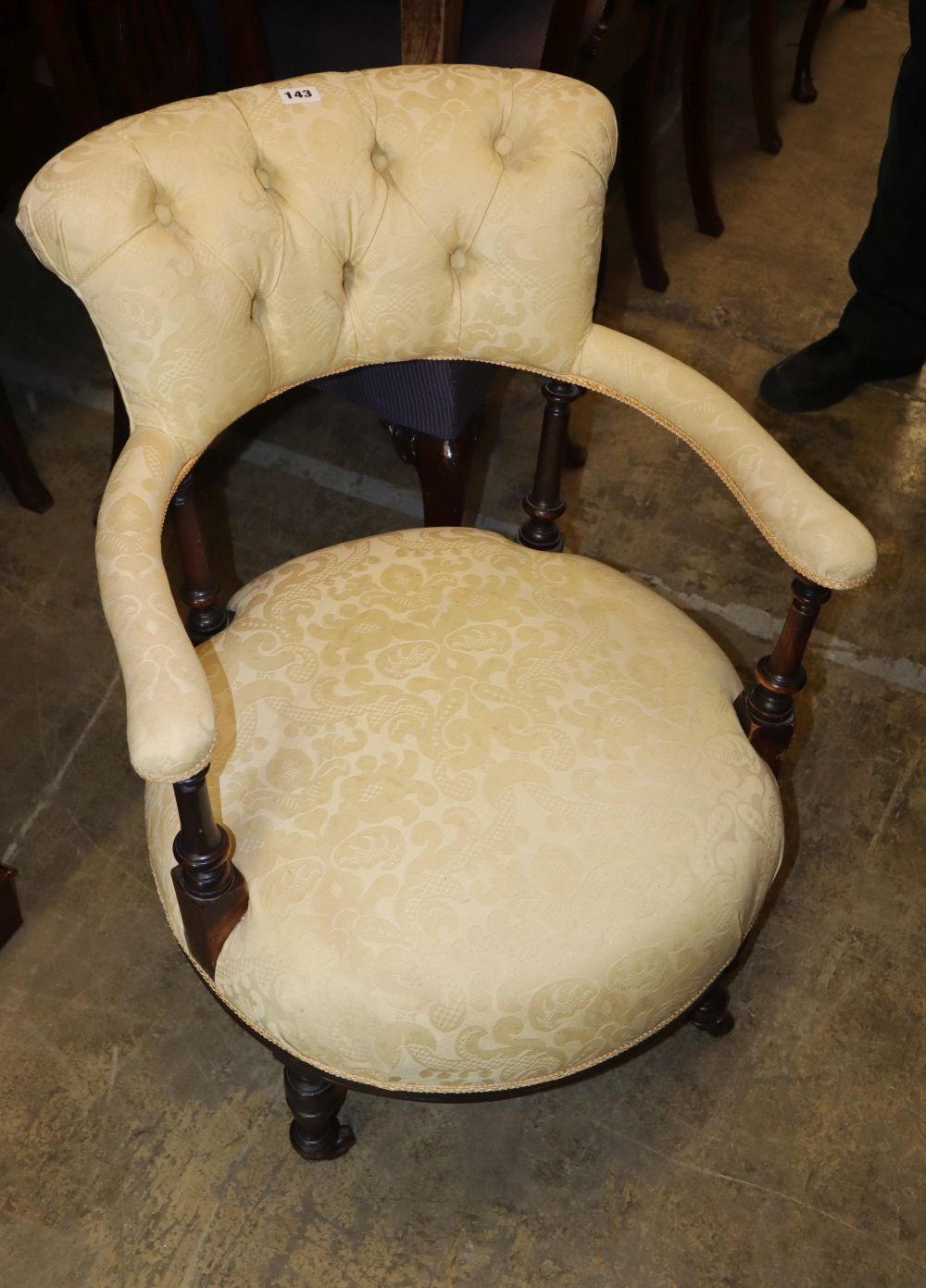 A Victorian stained wood show frame upholstered elbow chair